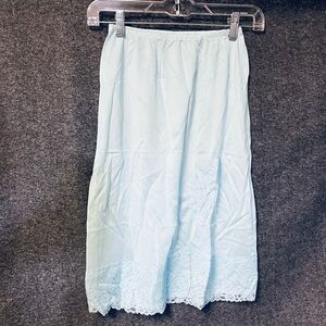 Vintage Adonna light blue slip skirt with lace hem and accent
Size small